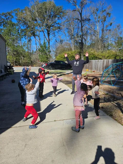 Children playing outside at recess on a sunny day